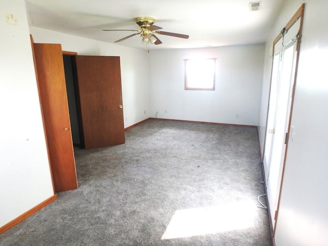 unfurnished bedroom with ceiling fan and carpet floors