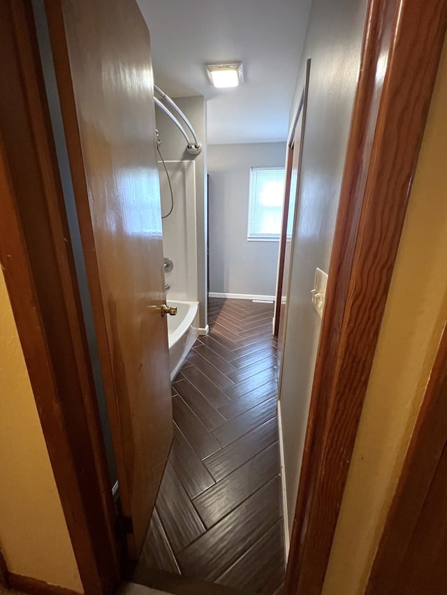 full bathroom featuring baseboards and shower / washtub combination
