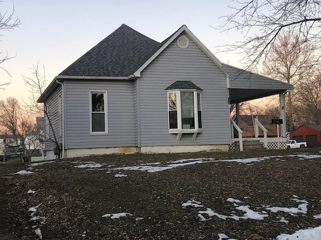 view of snow covered exterior featuring a porch