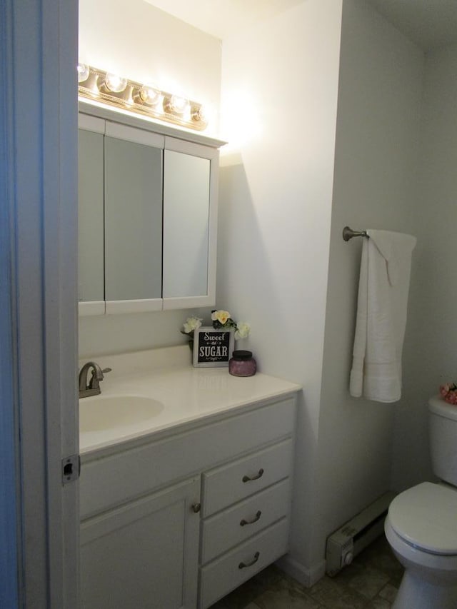 bathroom featuring toilet and vanity