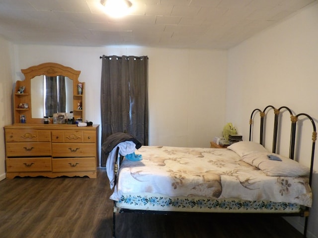 bedroom featuring dark wood-type flooring