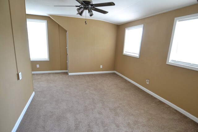 1415 E Patterson St, Kirksville, MO 63501 - spare room featuring a ceiling fan, lofted ceiling, plenty of natural light, and light carpet