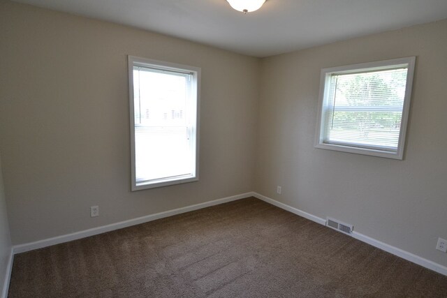 1415 E Patterson St, Kirksville, MO 63501 - empty room featuring carpet and baseboards
