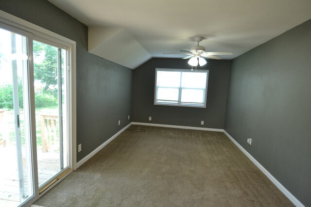 1415 E Patterson St, Kirksville, MO 63501 - additional living space featuring dark carpet, a ceiling fan, and vaulted ceiling