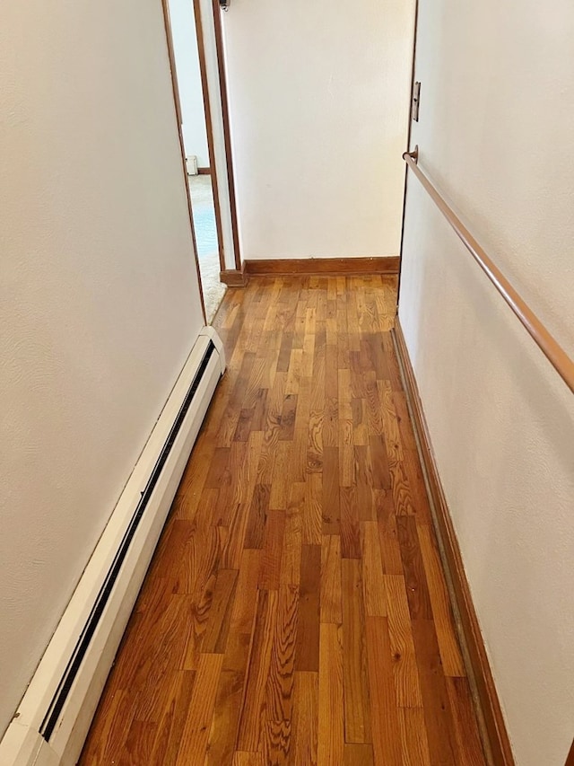 904 E George St, Kirksville, MO 63501 - corridor with baseboard heating and light wood-style floors