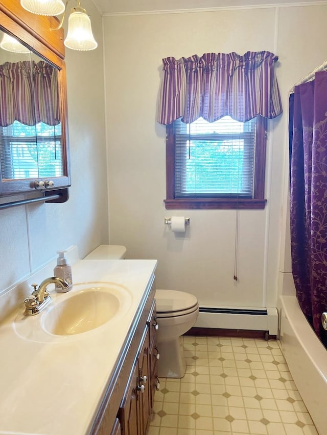 904 E George St, Kirksville, MO 63501 - bathroom featuring a baseboard heating unit, healthy amount of natural light, vanity, and tile patterned floors