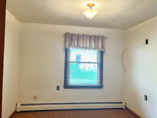904 E George St, Kirksville, MO 63501 - spare room with baseboard heating and carpet flooring