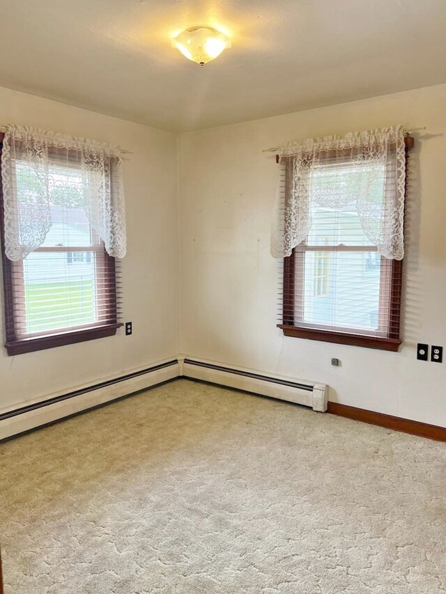 904 E George St, Kirksville, MO 63501 - carpeted spare room featuring a baseboard heating unit