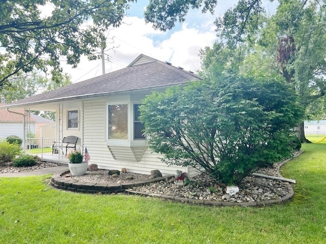 904 E George St, Kirksville, MO 63501 - rear view of house with a yard and a shingled roof