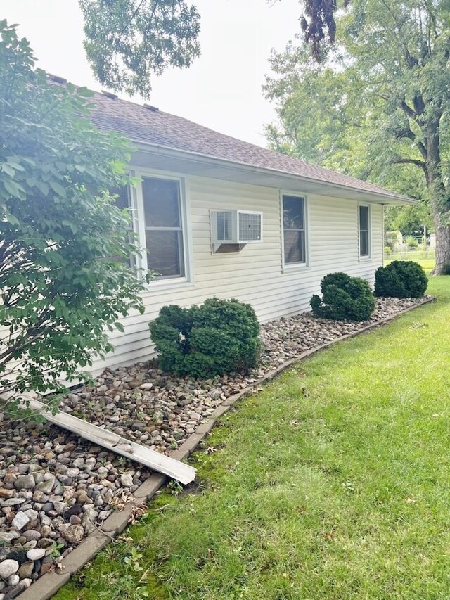 904 E George St, Kirksville, MO 63501 - view of side of property with a lawn, a shingled roof, and a wall mounted AC