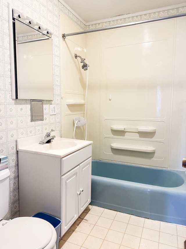 full bathroom with shower / washtub combination, vanity, tile patterned floors, and toilet