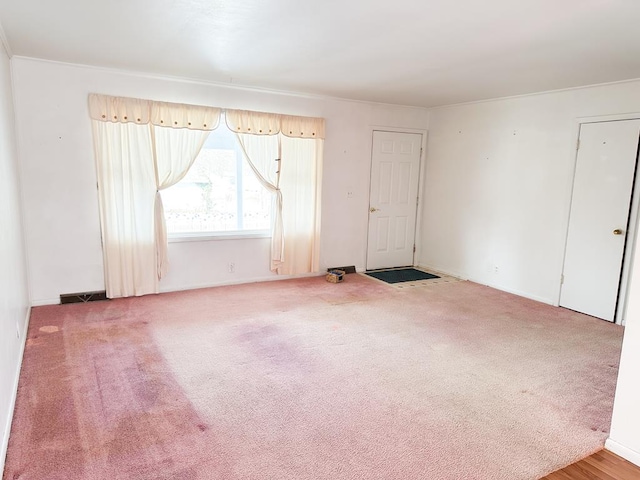 spare room featuring carpet floors