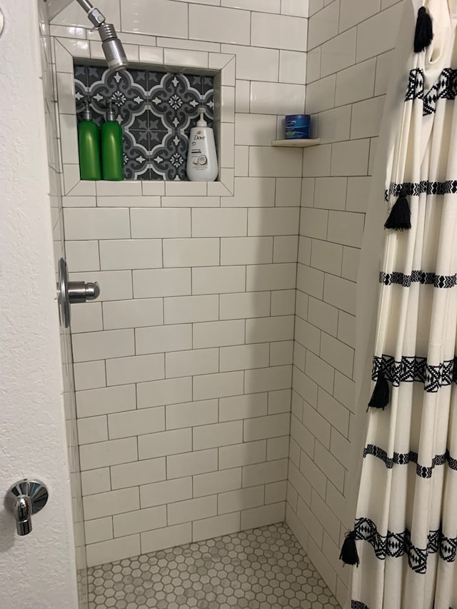 bathroom featuring a shower stall