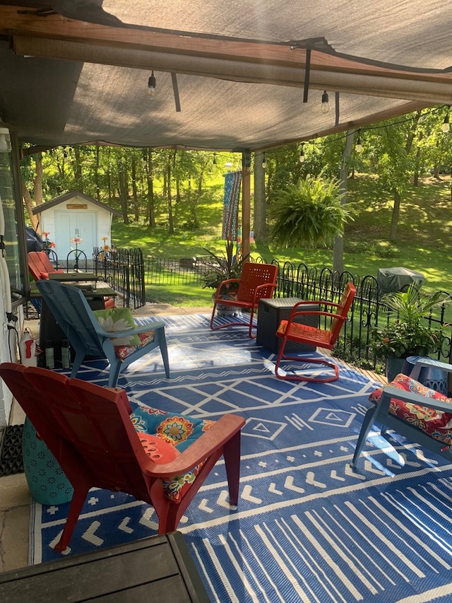 view of patio / terrace with an outbuilding and a storage unit