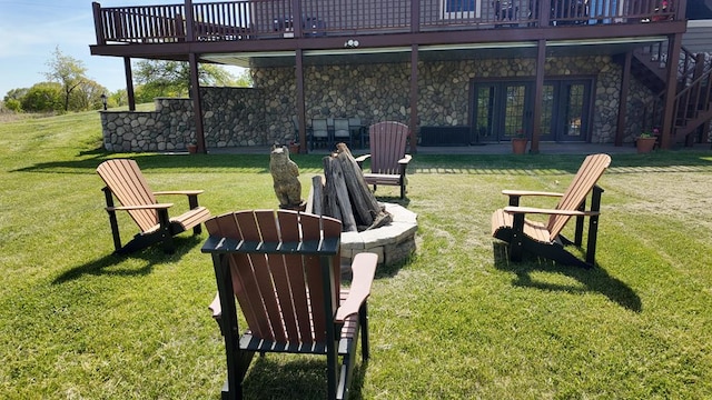 11265 Biplane, Mercer, MO 64661 - view of grassy yard with a deck, french doors, an outdoor fire pit, and stairs