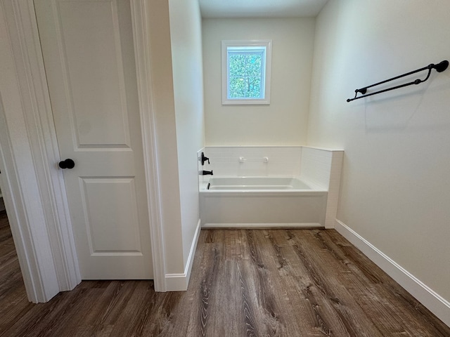 22585 State Highway K, Novinger, MO 63559 - bathroom featuring wood finished floors and a garden tub