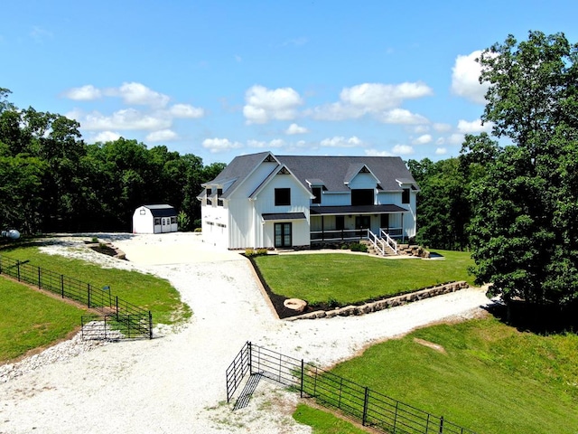 22585 State Highway K, Novinger, MO 63559 - modern inspired farmhouse featuring driveway, board and batten siding, and a storage unit
