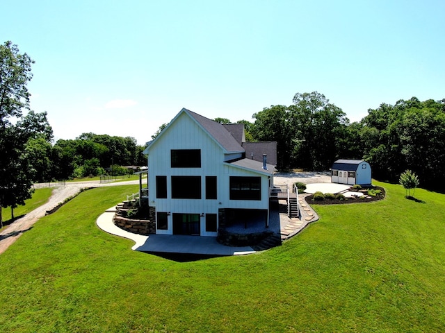 22585 State Highway K, Novinger, MO 63559 - rear view of property featuring a yard, a storage unit, and stairs