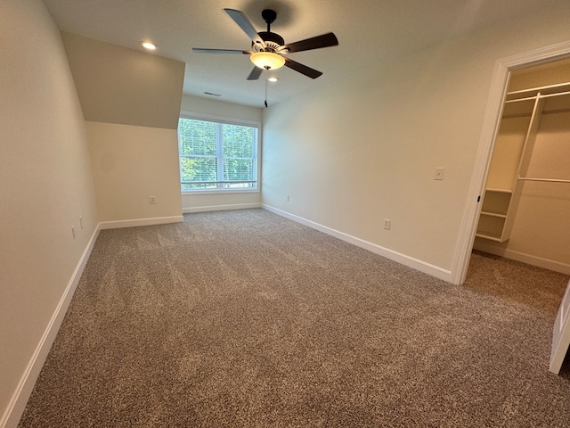 22585 State Highway K, Novinger, MO 63559 - unfurnished bedroom featuring a spacious closet, carpet, a ceiling fan, recessed lighting, and a closet