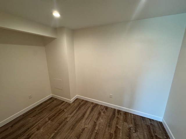 22585 State Highway K, Novinger, MO 63559 - spare room featuring dark wood-type flooring and baseboards
