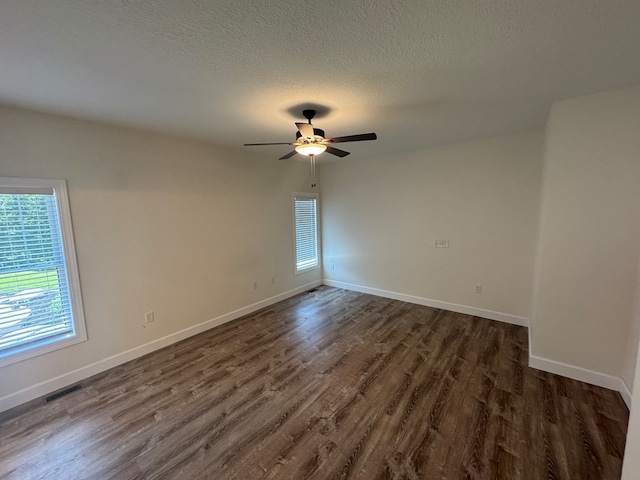 22585 State Highway K, Novinger, MO 63559 - unfurnished room with dark wood-type flooring, ceiling fan, and a textured ceiling
