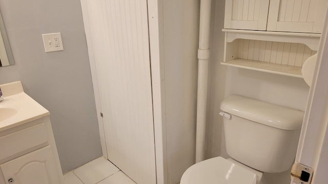507 W Illinois St, Kirksville, MO 63501 - bathroom with vanity, toilet, and tile patterned flooring