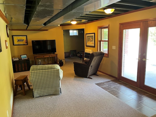 living room featuring carpet flooring, baseboards, and french doors