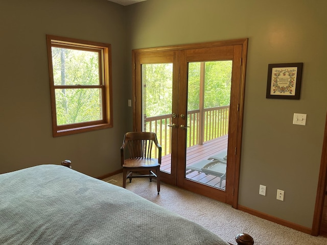 bedroom featuring carpet flooring, baseboards, french doors, and access to exterior