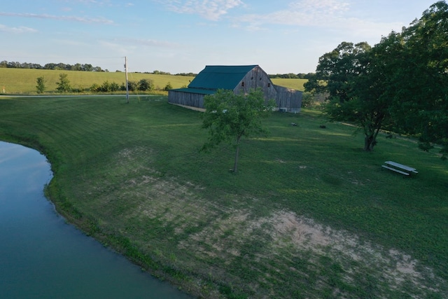 aerial view with a rural view and a water view