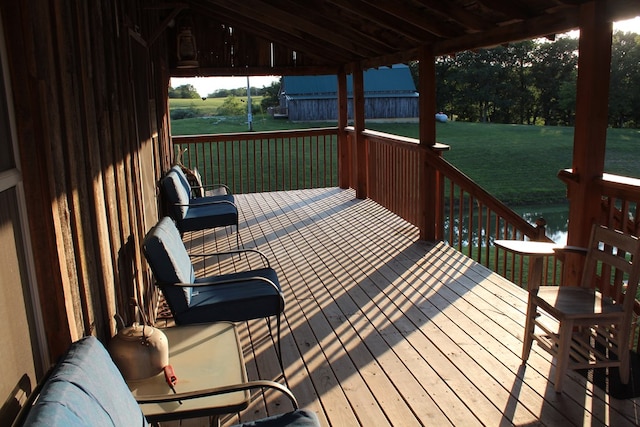 wooden deck with a yard