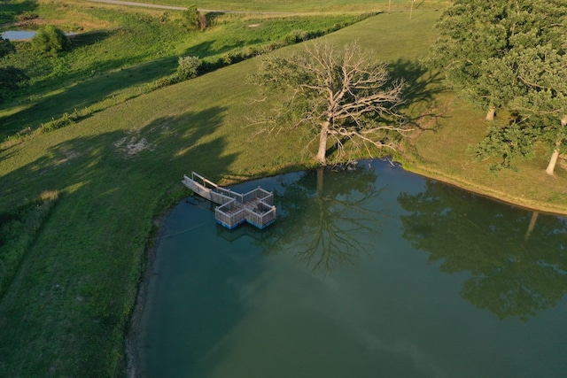 aerial view with a rural view and a water view