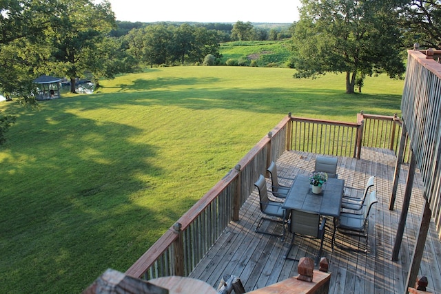 wooden terrace with a yard