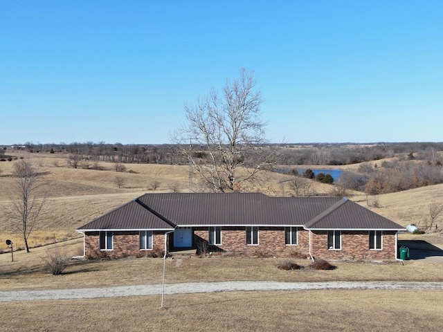 view of front of property with metal roof and a carport