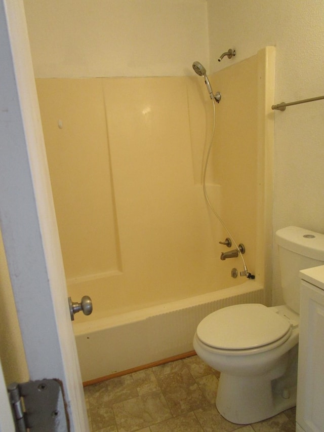 full bath featuring tub / shower combination, vanity, and toilet