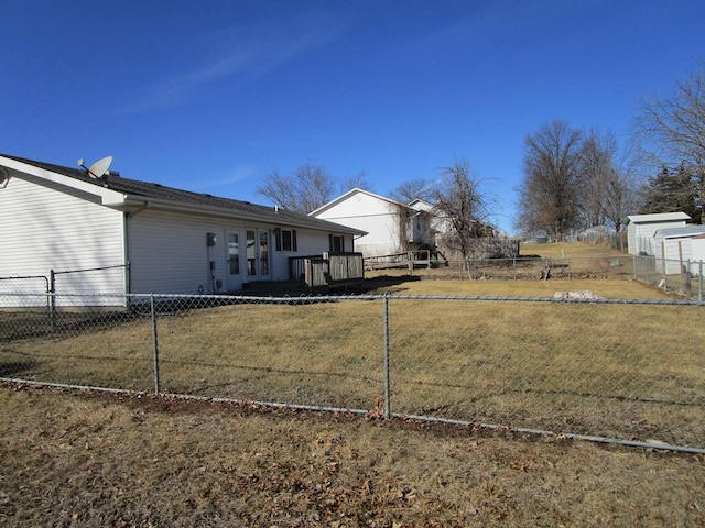 view of yard featuring fence private yard and a wooden deck