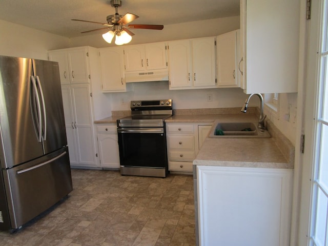 kitchen featuring white cabinets, under cabinet range hood, stainless steel appliances, and a sink