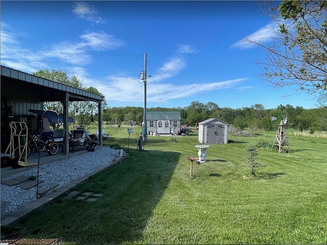 view of yard featuring an outbuilding and a storage shed