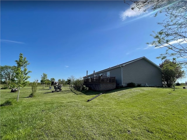 view of yard with a wooden deck