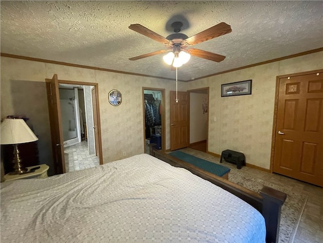 bedroom with ornamental molding and a textured ceiling