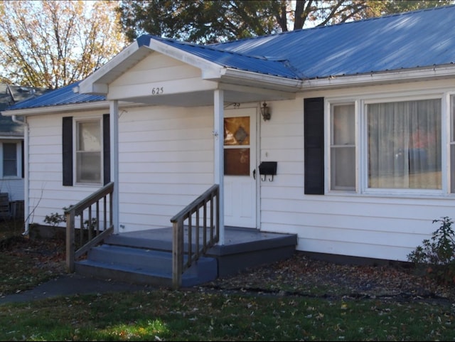 doorway to property featuring cooling unit