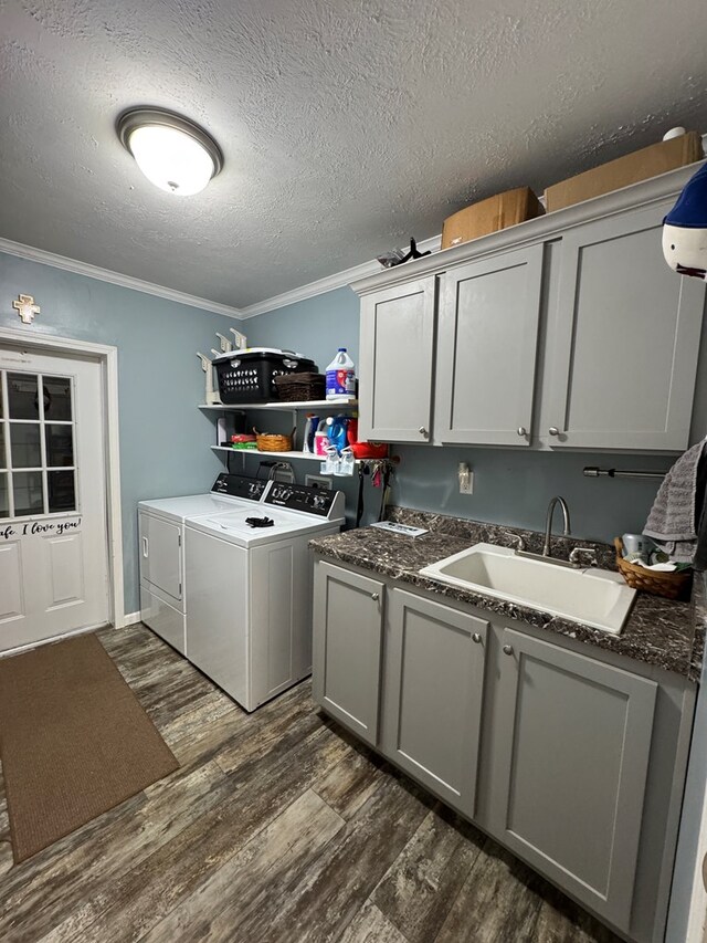 210 N Grant St, Green City, MO 63545 - washroom with washing machine and clothes dryer, cabinet space, dark wood finished floors, crown molding, and a textured ceiling