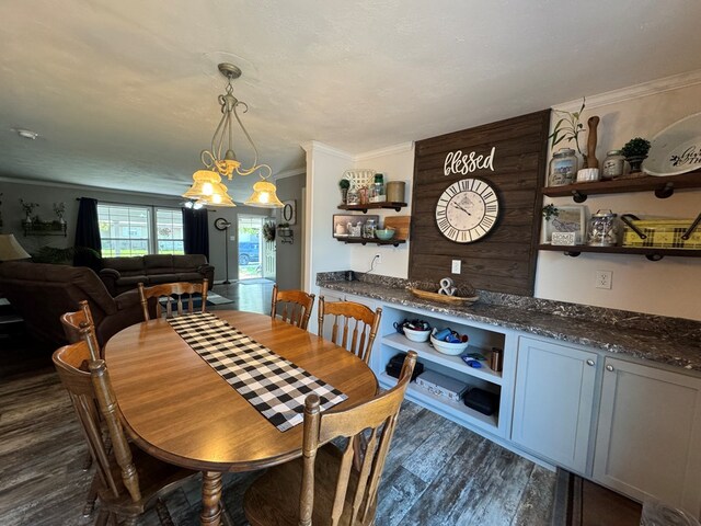 210 N Grant St, Green City, MO 63545 - dining area with dark wood finished floors, ornamental molding, and a chandelier