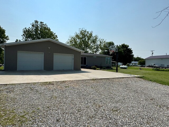 210 N Grant St, Green City, MO 63545 - view of front of house featuring a front lawn and an outbuilding