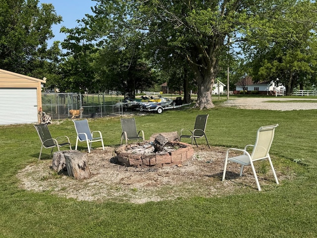 210 N Grant St, Green City, MO 63545 - view of yard featuring a fire pit and view of wooded area