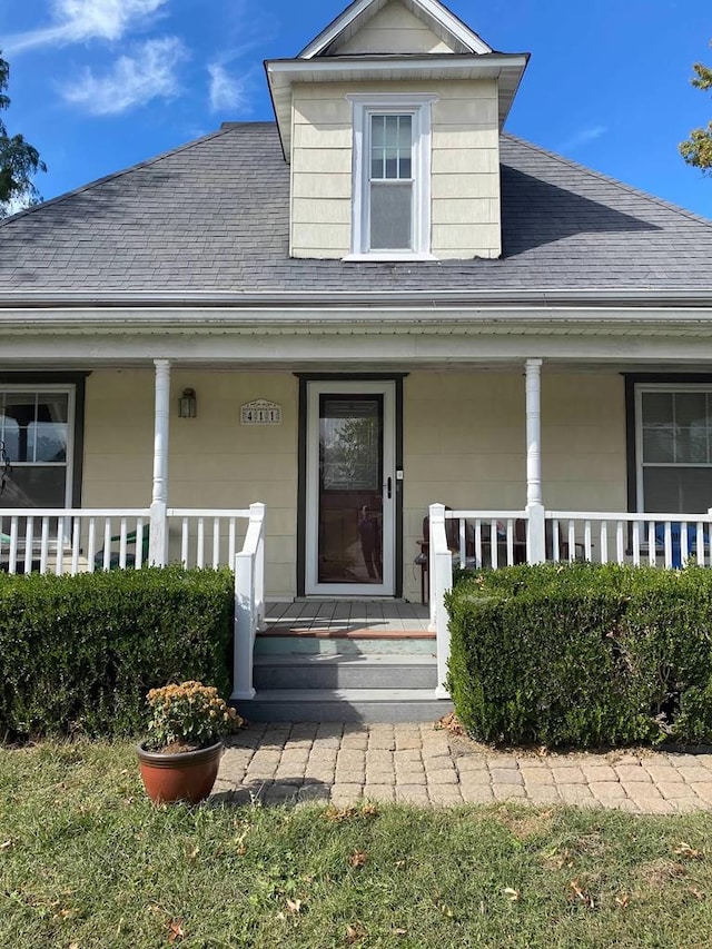 411 W W, Callao, MO 63534 - entrance to property featuring a porch and a shingled roof
