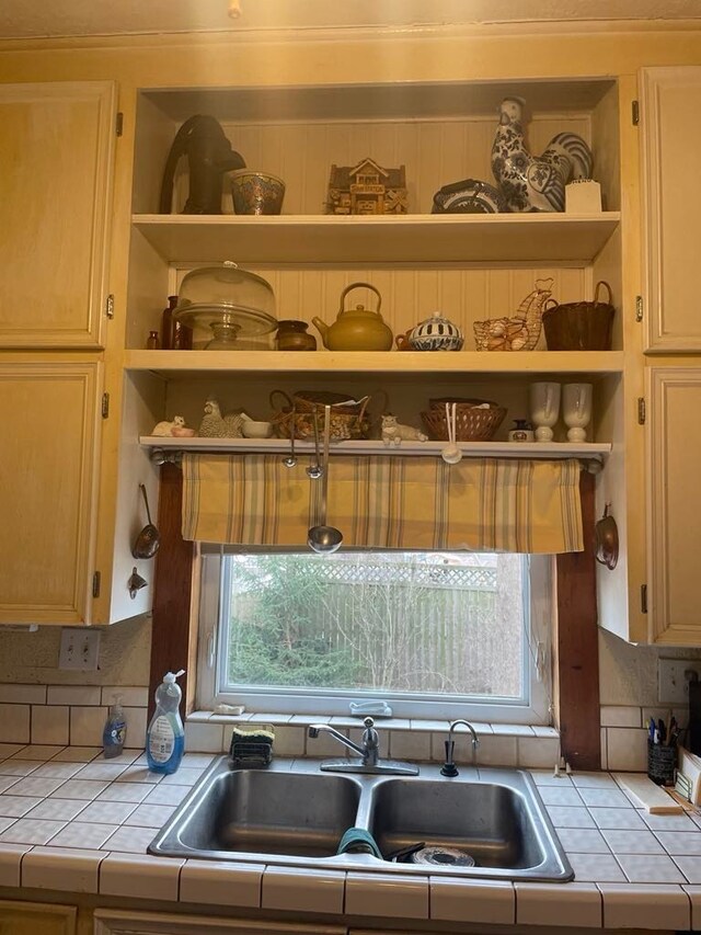 411 W W, Callao, MO 63534 - kitchen with tile counters, open shelves, a sink, and decorative backsplash