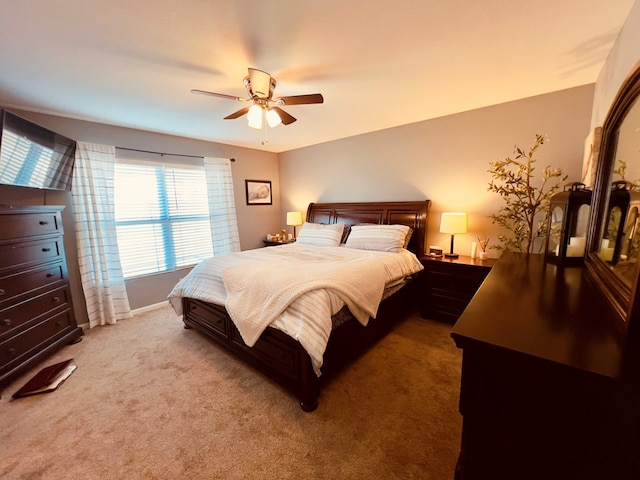 bedroom with ceiling fan and light colored carpet