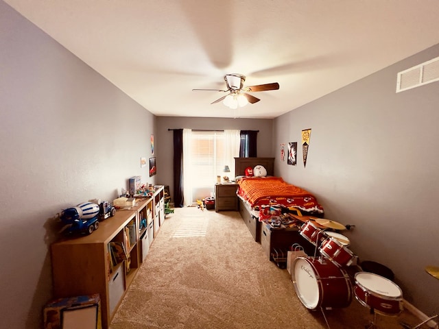 bedroom with light colored carpet and ceiling fan