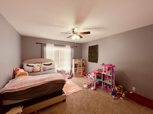 bedroom featuring light carpet and ceiling fan