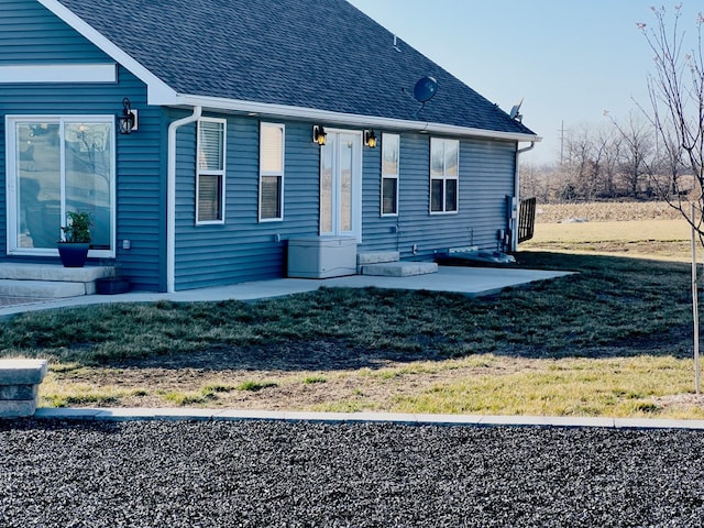 exterior space with a lawn and a patio area